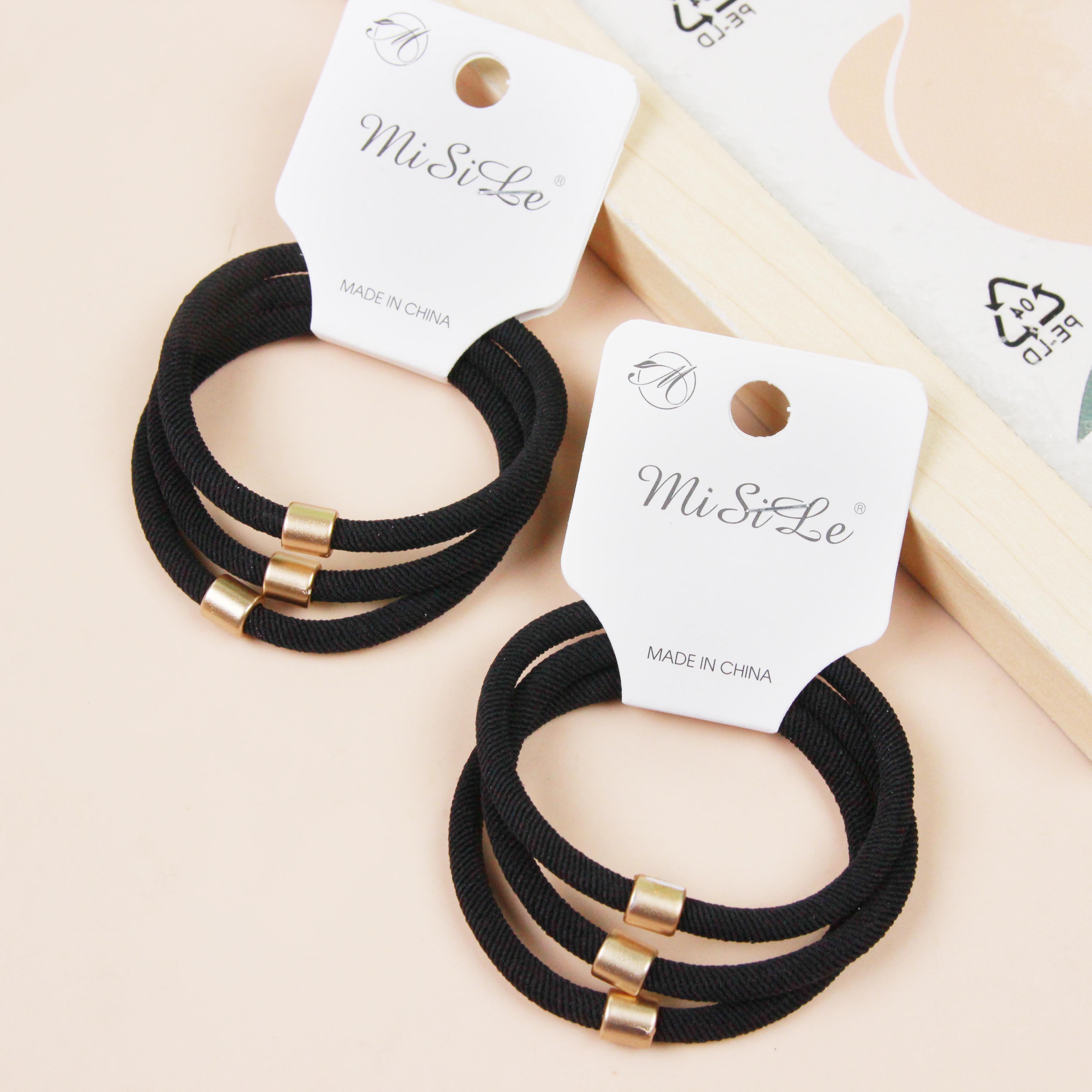 Three Black Gold Tube Spiral Hair Ties