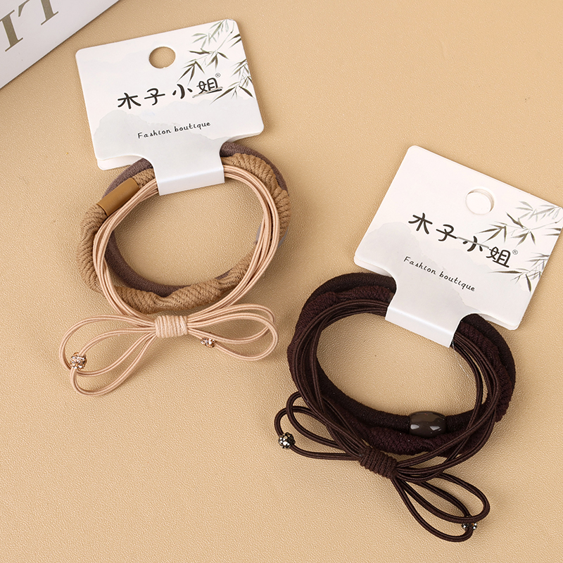 Three milk tea colored knotted rubber bands - Image 2