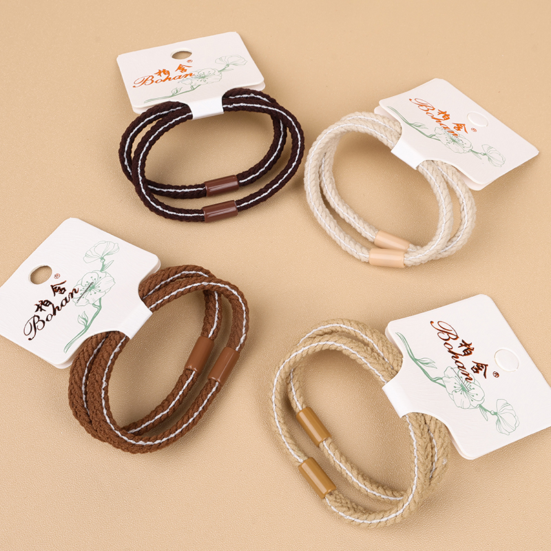 Two cream braid flat bands